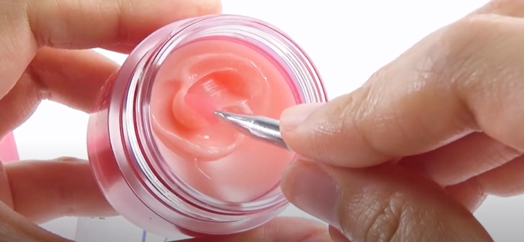 applying korean lip balm