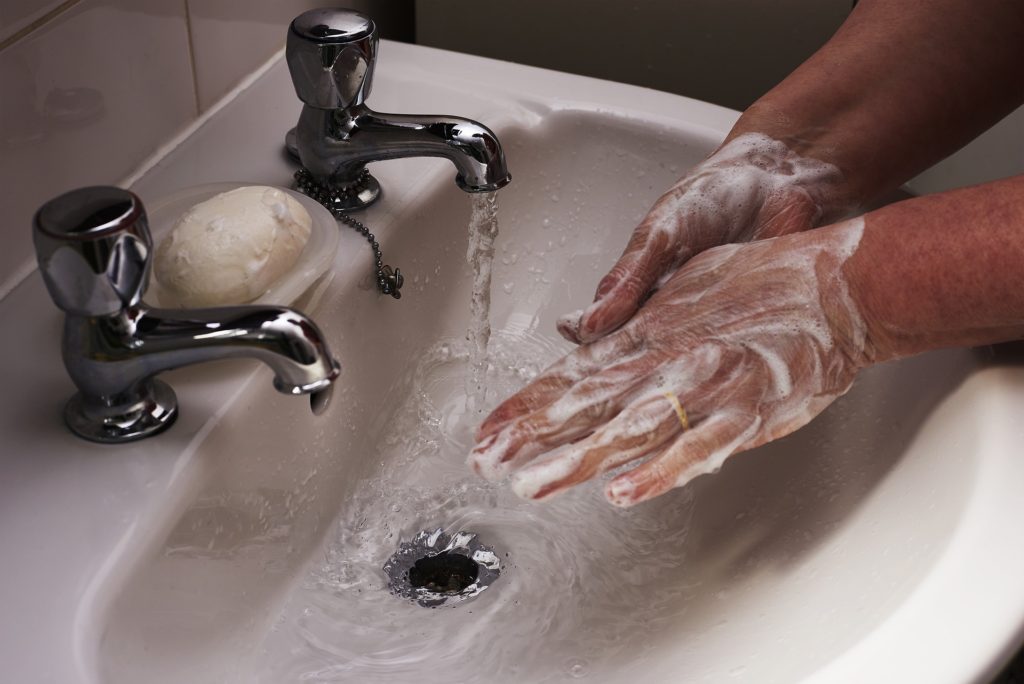 washing hands with antibacterial soap